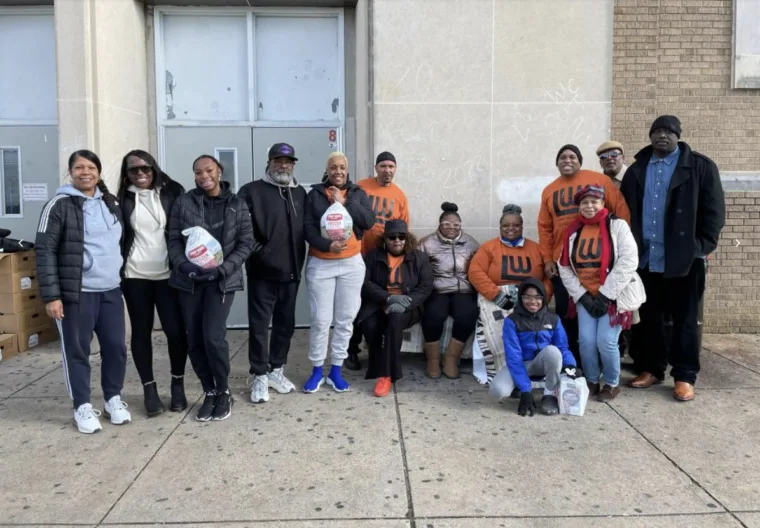 Volunteers and families at the Turkeys for Teachers giveaway